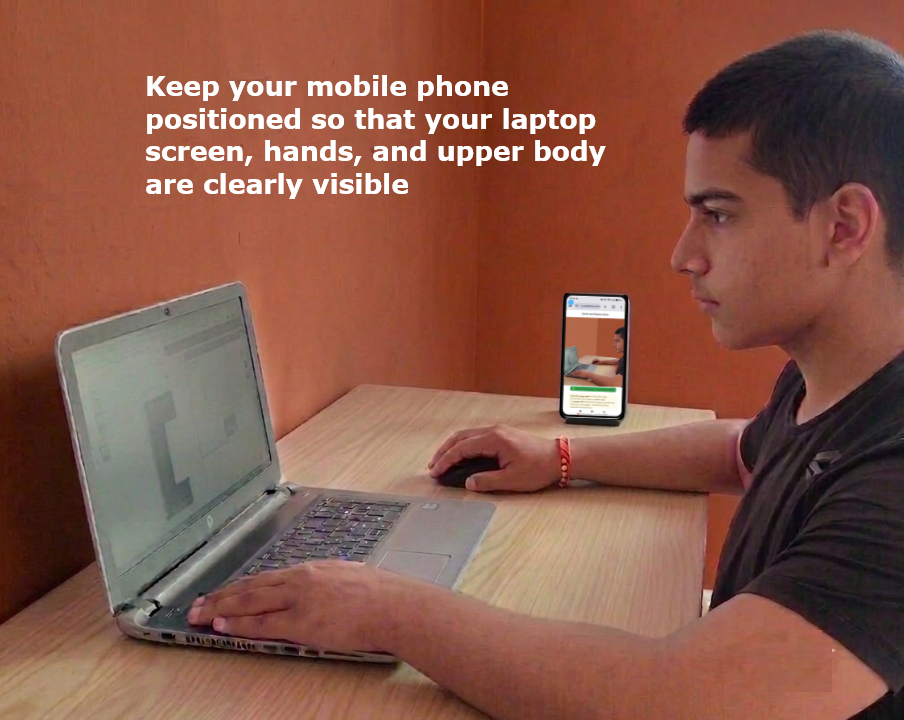 Laptop and phone set up side by side for dual proctoring